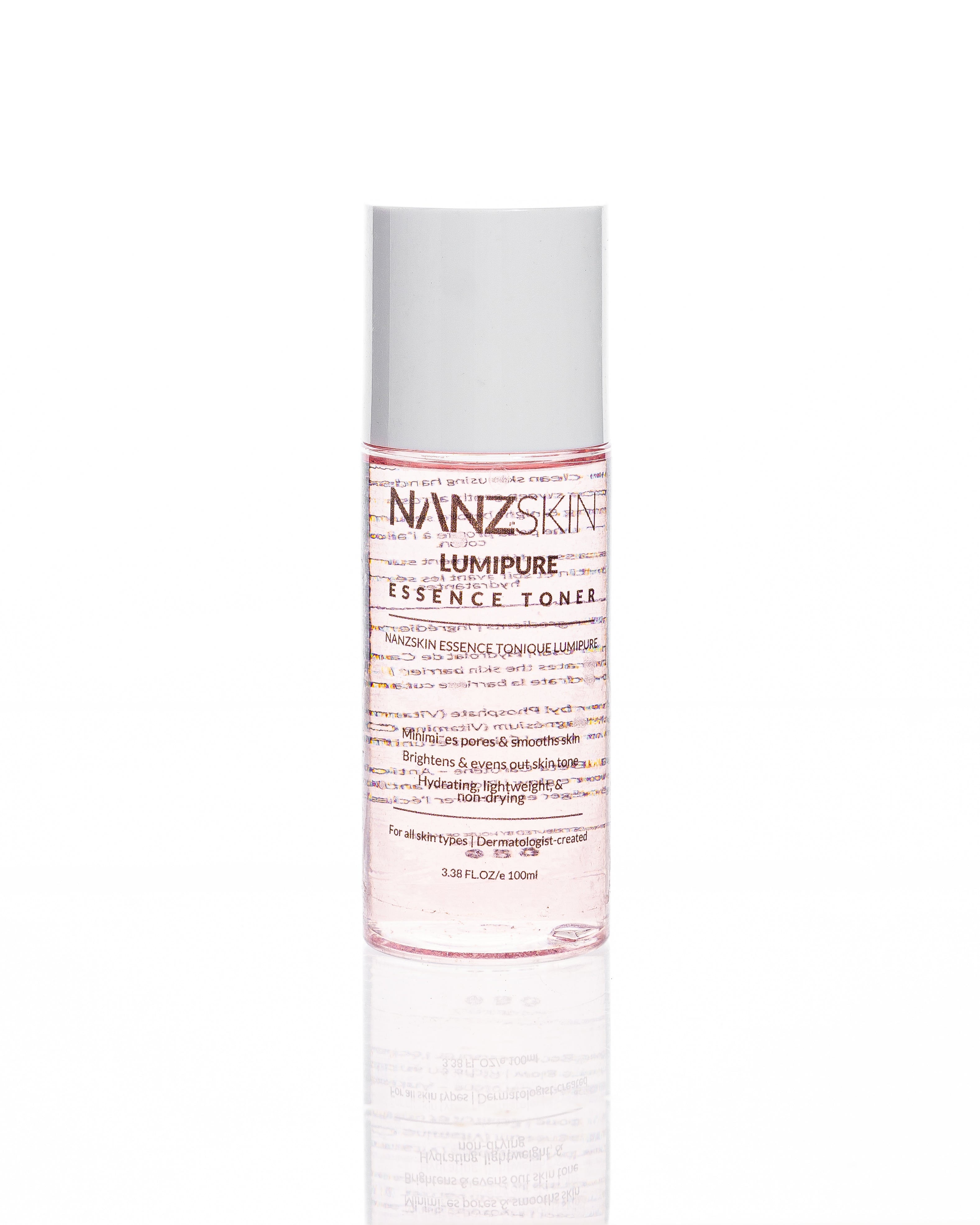 A pump bottle of Nanzskin Lumipure Essence Toner with clear liquid visible inside.